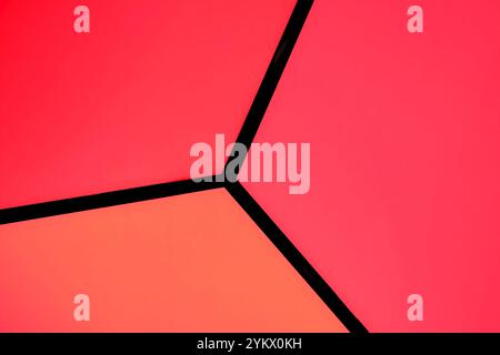 Texture: Corner of a large illuminated cube in the colors orange, red and pink Stock Photo