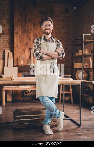 Photo of professional smiling woodworker standing cross arms in workshop garage home Stock Photo