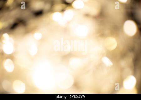 Golden brown Christmas bokeh background. Blurred white garland lights background with glitters and soft reflections for rendering, greeting cards Stock Photo
