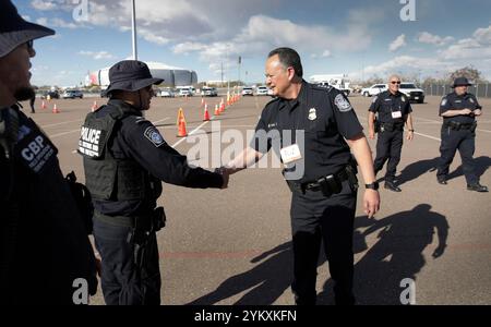 U.S. Customs and Border Protection Executive Assistant Commissioner Office of Field Operations Pete Flores visits with CBP officers conducting Non-Intrusive Inspections on a secure lot in advance of Super Bowl LVII in Glendale, Ariz., Feb. 6, 2023. CBP Photo by Glenn Fawcett Stock Photo