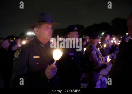 U.S. Customs and Border Protection Acting Deputy Commissioner Benjamine C. Huffman, left, and Executive Assistant Commissioner Office of Field Operations Pete Flores hold their candles during the 35th Annual Candlelight Vigil in Washington, D.C., May 13, 2023. CBP photo by Glenn Fawcett Stock Photo