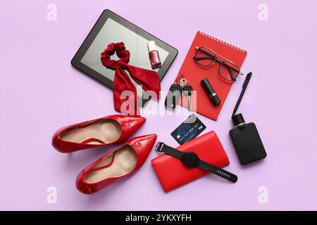 Composition with stylish female accessories, shoes, modern gadgets and car keys on color background Stock Photo