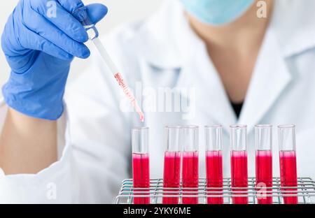 Cropped shot of a scientist conducting an experiment in a laboratory Stock Photo