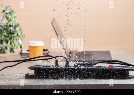 Dangerous from rainy or water drops on a power strip short circuit and overload at home Stock Photo