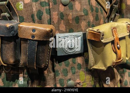 A close-up view of the belt with accessories on the uniform of a Waffen SS soldier Stock Photo