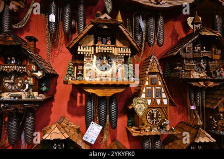 Cuckoo clocks on a shop wall  – Bruges, Belgium – 23 October 2024 Stock Photo