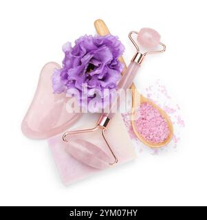 Face roller, soap, gua sha, sea salt and flower isolated on white, top view Stock Photo