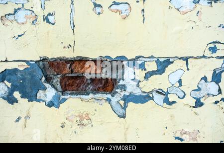 old rough wall background with cracks and bricks Stock Photo