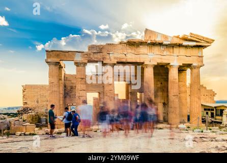 Motion blur image of people strolling around the Parthenon temple on sunny day, Athens, Greece Stock Photo