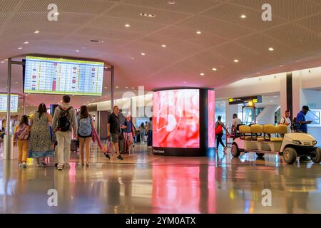 Travelers transiting through JFK International airport Stock Photo