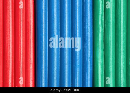 Artistic plastic clay for modeling in a box. Children red green blue RGB plasticine modeled for learning craft. Art of modeling material close up. Stock Photo