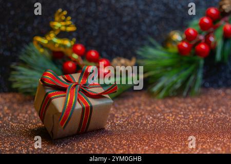 Christmas and new year background. Gift boxes and pine cones and branches on the background of bokeh. Stock Photo