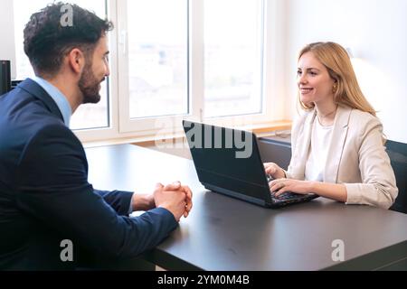 Professional business meeting between two colleagues in a bright office. Stock Photo