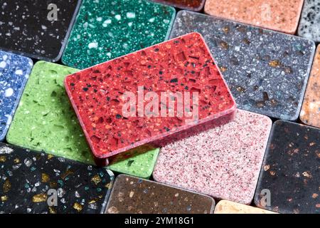 Porcelain stoneware artificial stone square samples as kitchen countertop examples of future kitchen fasade exterior. Samples slabs of natural granite Stock Photo