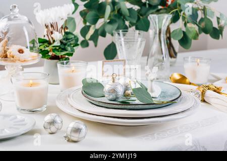 Traditional festive place setting for Christmas, decorated with eucalyptus branch Stock Photo