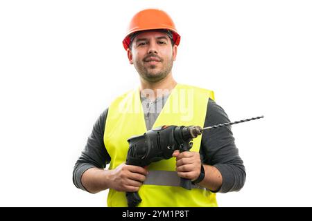 Happy male constructor in work attire orange safety hardhat and fluorescent vest holding cordless drill building equipment isolated on white backgroun Stock Photo