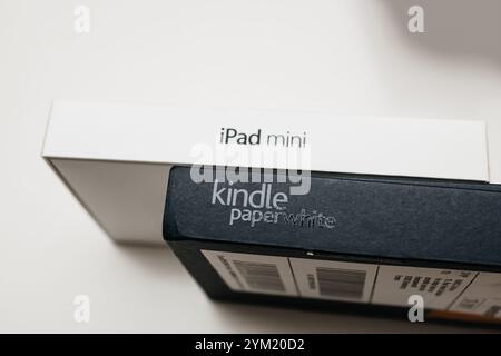 Paris, France - Jan 14, 2015: Product packaging featuring iPad Mini and Kindle Paperwhite boxes, showcasing tech devices designed for reading, browsing, and multimedia Stock Photo