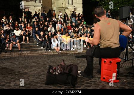 Rome, Italy - November 1, 2024: A street musician performs in Trastevere district in Rome. Stock Photo