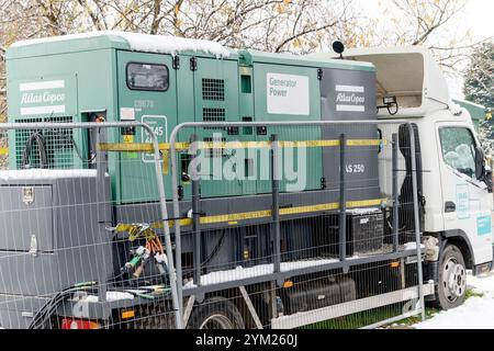 An emergency diesel power generator supplies homes in West Yorkshire with electrical power after a power cut. Stock Photo