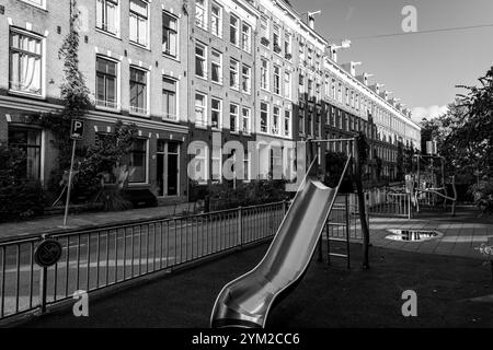 Amsterdam, NL - OCT 14, 2021: Street view and generic architecture in Amsterdam with typical Dutch style buildings. Amsterdam is one of Europe's most Stock Photo