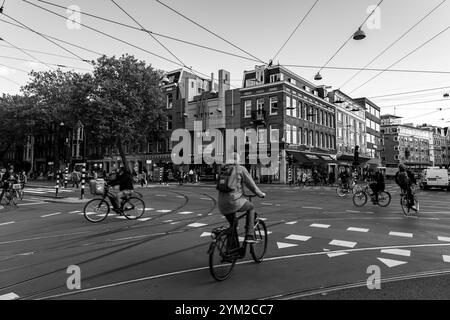 Amsterdam, NL - OCT 14, 2021: Street view and generic architecture in Amsterdam with typical Dutch style buildings. Amsterdam is one of Europe's most Stock Photo