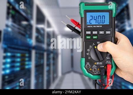 Digital Multimeter Displaying Voltage in Data Center Stock Photo