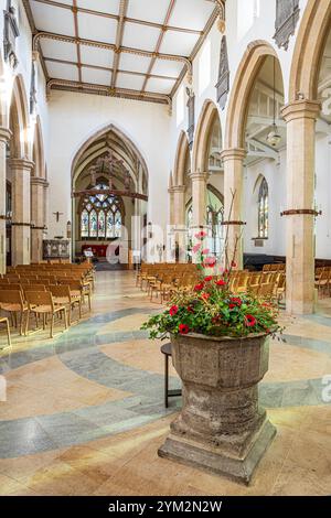 The interior of Holy Trinity church in the Cotswold village of Minchinhampton, Gloucestershire, England UK Stock Photo