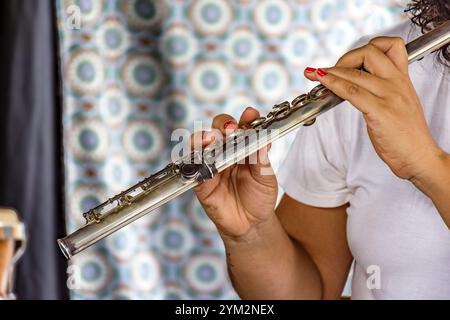 Musical performance with transverse flute being played by a woman in Brazil Belo Horizonte, Minas Gerais, Brazil, South America Stock Photo