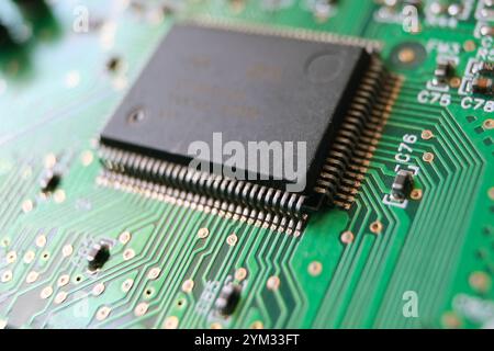 Close up of a semiconductor microchip. Advanced technology concept background circuit board texture. Stock Photo