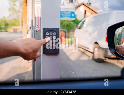 Hand pressing button on keypad Stock Photo