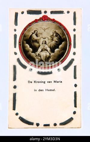 Vintage Dutch Prayer card Depicting the Coronation of Virgin Mary in Heaven with the Holy Trinity The Father, The Son and the Holy Ghost Stock Photo