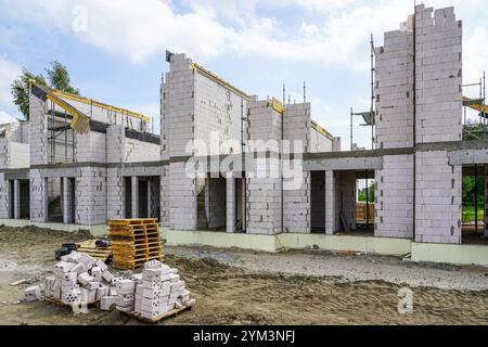 Construction site of a new residential terraced house from expanded clay blocks with concrete covers and thermally insulated foundations Stock Photo