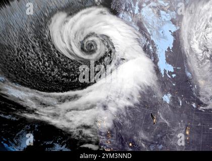 Pacific Ocean, United States. 20th Nov, 2024. The early morning NOAA GEOS-West satellite image showing the rotating storm system called a Bomb Cyclone churning in the Pacific Ocean, November 20, 2024 off the coast of Washington State. Credit: NESDIS/STAR GOES-West/NOAA/Alamy Live News Stock Photo