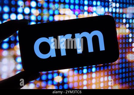 In this photo illustration, the Arm Holdings company logo is seen displayed on a smartphone screen. Stock Photo
