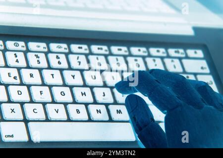 Robot hands focus on a laptop button, representing the seamless operation of an advisor chatbot within the realm of artificial intelligence. Stock Photo