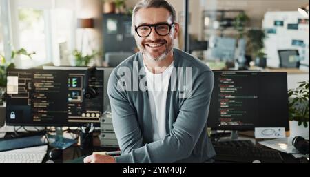 Man, programmer and glasses in office for portrait, web development or software engineering on screen. Mature coder, happy or tech in agency for Stock Photo