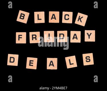 "Black Friday Deals" on small wooden tiles against black background Stock Photo