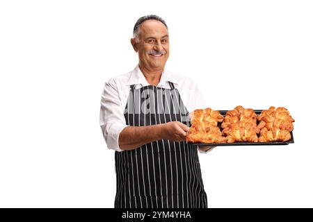 Man holding a tray with croissants isolated on white background Stock Photo