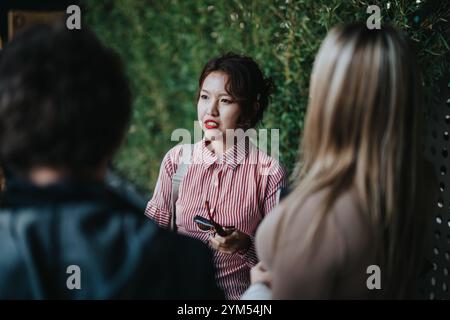 Young professional women having a conversation outdoors Stock Photo