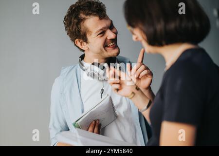 Two students happily discussing a project outdoors closeup Stock Photo
