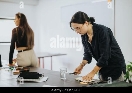 Students collaborating on school tasks in a modern classroom setting Stock Photo
