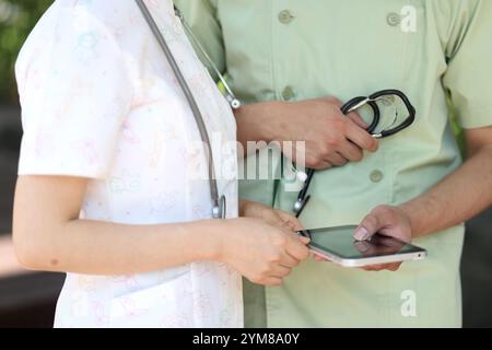 Nurses and doctors consulting using a tablet pc Stock Photo