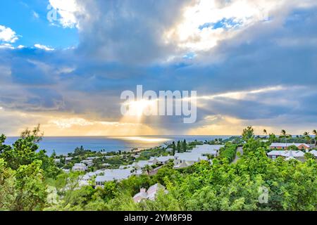 Sunlight Breaking Through Dramatic Clouds Casting Rays on Southampton Parish Bermuda Stock Photo