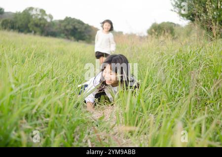 Girl falling on grass Stock Photo