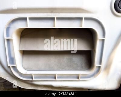 Rear air vent of car body close-up. The vents are usually positioned behind the back bumper on the sides of the car, and almost always consist of a se Stock Photo