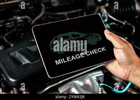 Check the maintenance mileage of used car , The display shows car maintenance checks on a tablet , Car maintenance concept Stock Photo