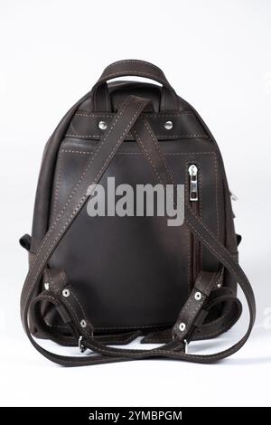 Leather women's backpack on a white background isolate. Leather bags and backpacks. Stock Photo