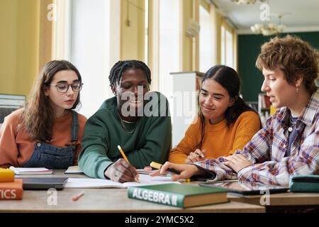 Collaborating Students Working on Algebra Project Together Stock Photo