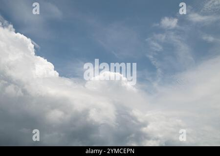 Thick white clouds decorated the clear blue sky Stock Photo