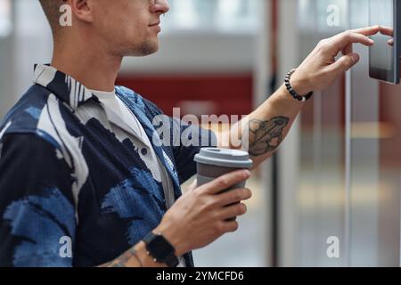 Cropped shot of businessman entering access code on sensor touch screen for unlocking office room, modern security system concept Stock Photo